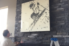 art hung on stone fireplace, Arvada