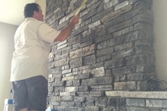 Measuring for pilot holes in stone, Arvada, CO